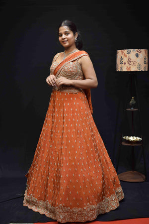Elegant Peach Orange Lehenga Saree with Intricate Silver Embroidery