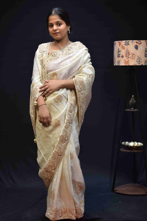 Elegant Ivory White Banarasi Saree with Intricate Gold Embroidered Border