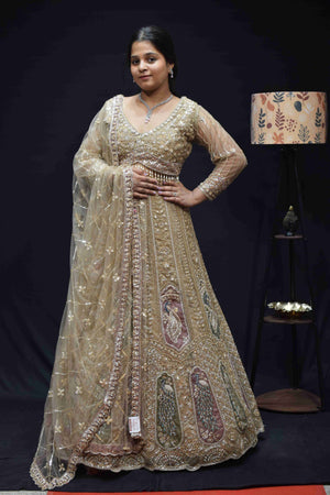 Elegant Champagne Gold Bridal Lehenga with Peacock Embroidery