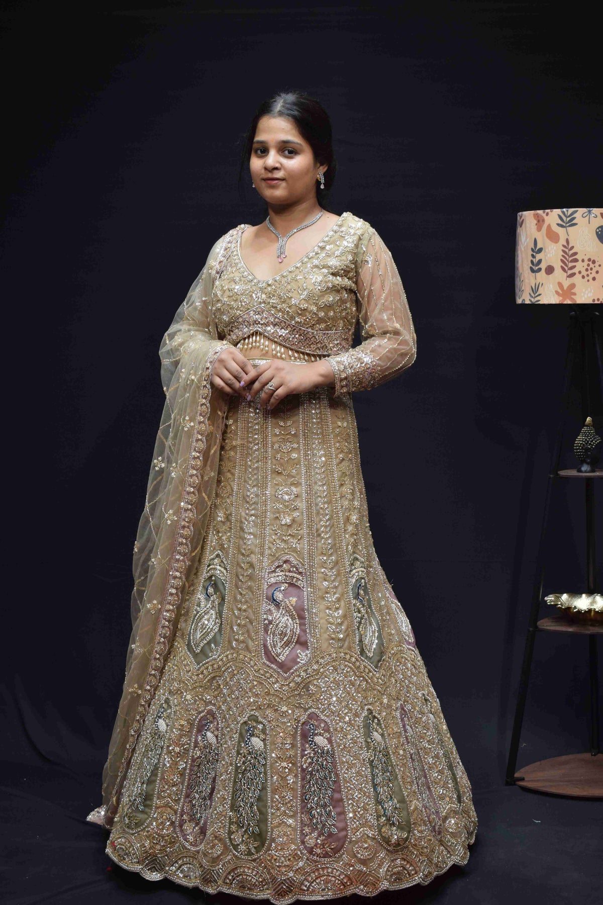 Elegant Champagne Gold Bridal Lehenga with Peacock Embroidery