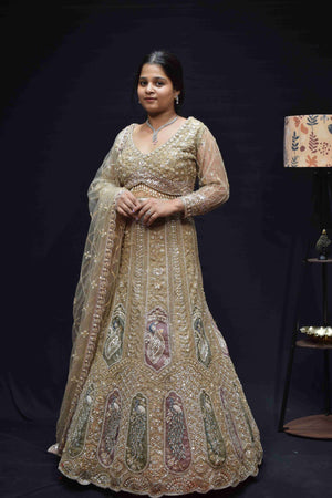 Elegant Champagne Gold Bridal Lehenga with Peacock Embroidery