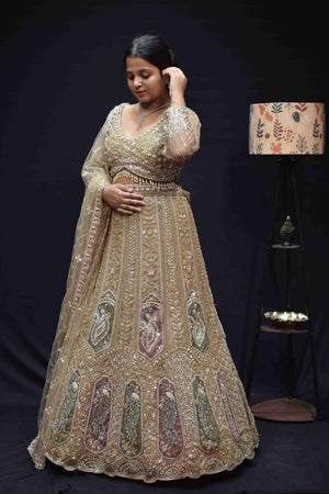 Elegant Champagne Gold Bridal Lehenga with Peacock Embroidery