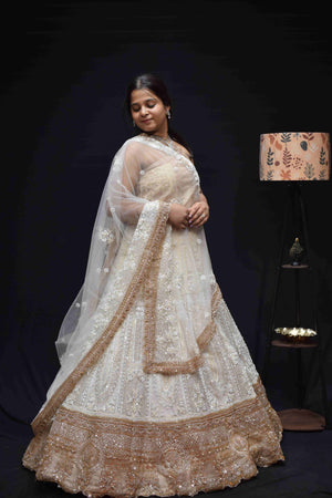 Luxury Ivory Gold Bridal Lehenga with Intricate Embroidery